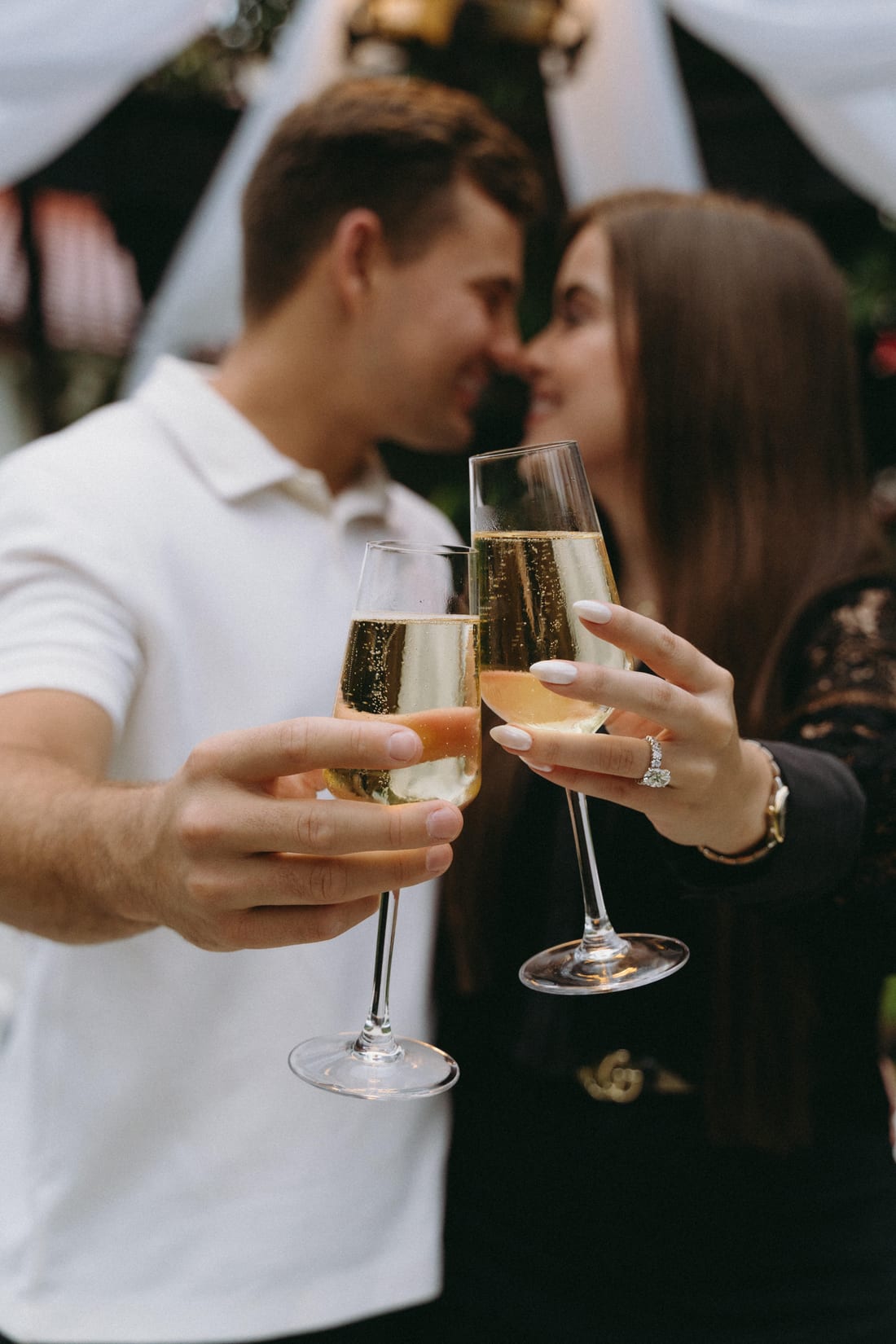 Savannah and Justin raising champagne glasses