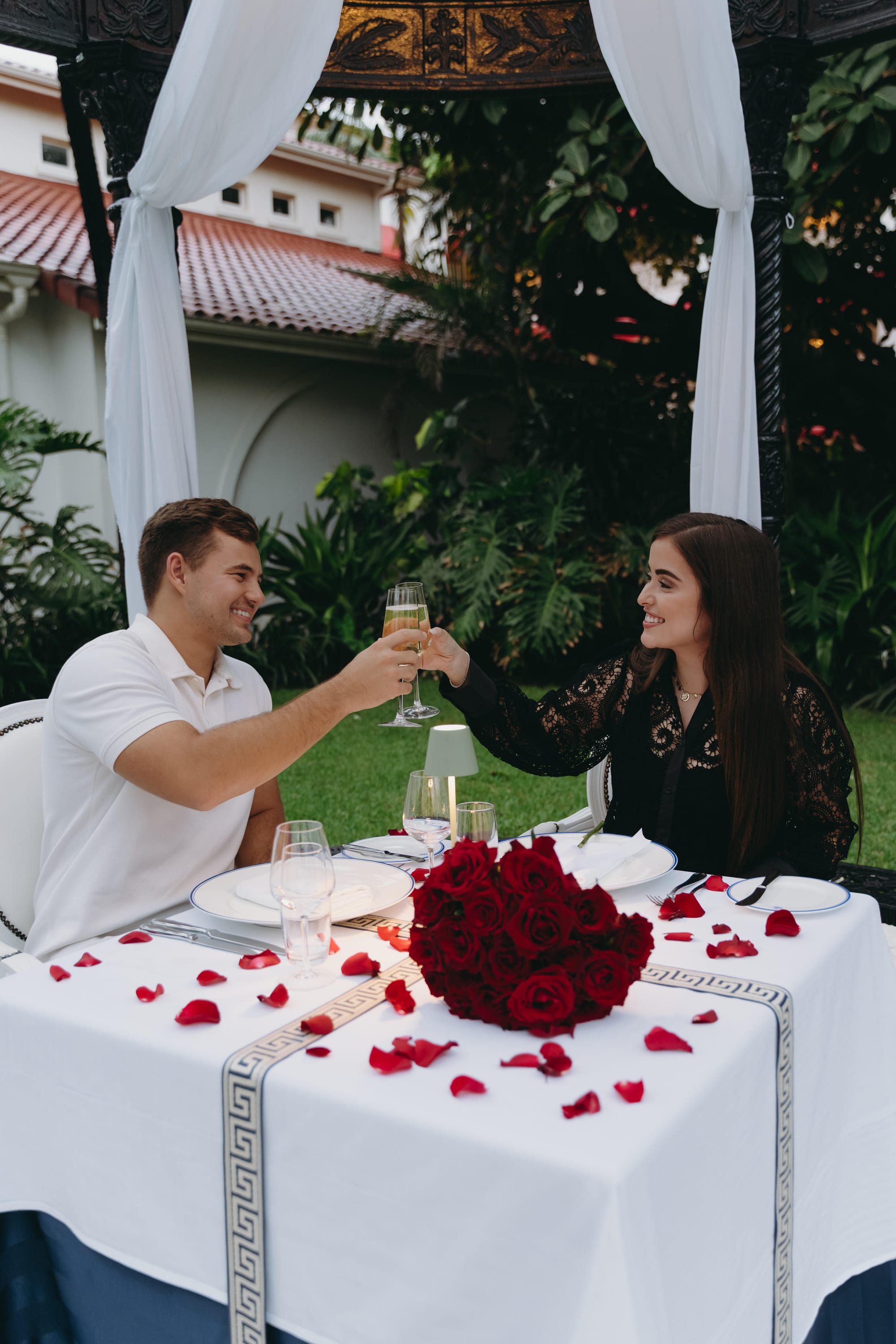 Savannah and Justin toasting with champagne at the dinner table